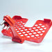 Empty red mobile charging wall holder, ready for use.