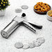 Stainless steel kitchen press with 15 interchangeable discs for making various Indian snacks.