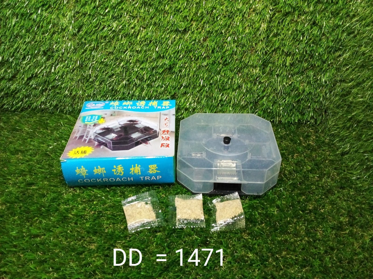 Blue box for a cockroach trap, a clear trap, and three bait packets on a green artificial grass background.