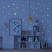 Close-up view of a luminous star wall decal, showing its bright glow in a dark room.