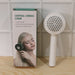 Side view of the innovative Self-Cleaning Hair Brush with its unique air cushion.