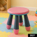 Folded plastic step stool for children, showcasing its space-saving design.