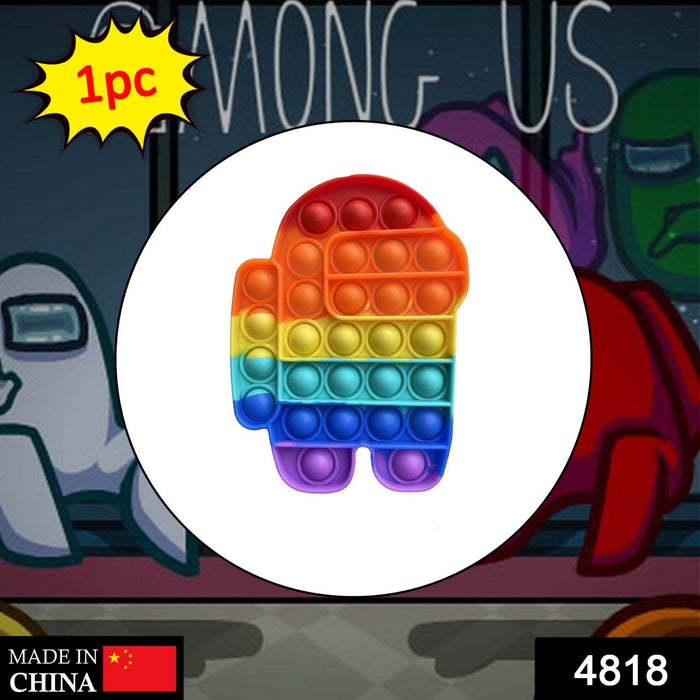 A rainbow Among Us character pop-it fidget toy is centered over a blurred background of Among Us characters.