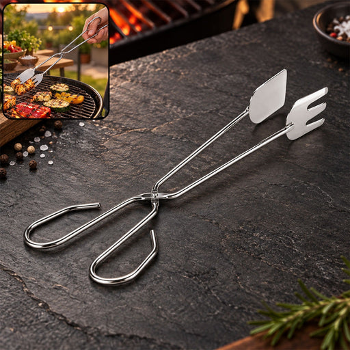 Shiny stainless steel tongs with a spatula and fork end, on a dark stone surface with a blurred BBQ scene inset.