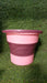 The compact foldable water bucket neatly collapsed for easy storage.