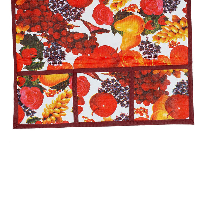 A close-up view of the fruit-patterned refrigerator top cover, highlighting the pocket details and fabric texture.