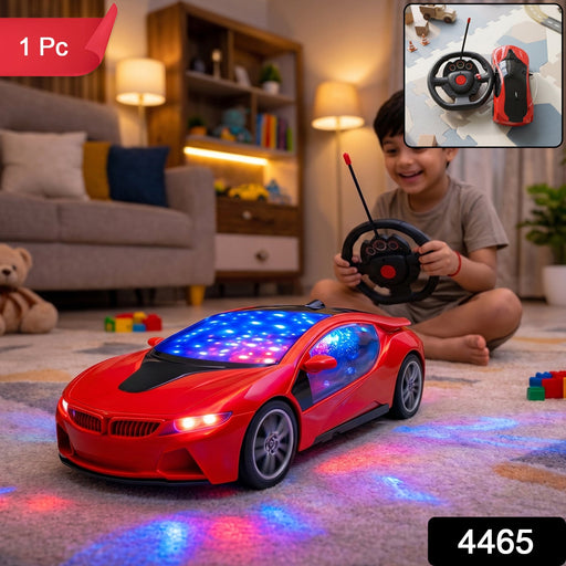 A young boy smiles while playing with a red remote control car that projects colorful lights onto the carpet, with a small
